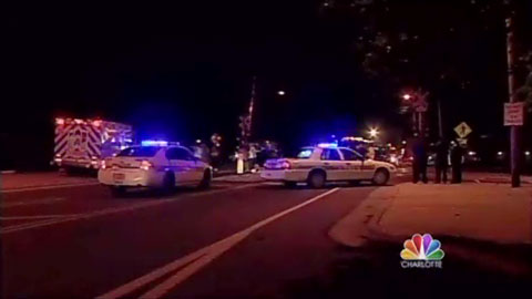 Police and Emergency crews treat the injured at a light rail train accident in southeast Charlotte, NC where one vehicle was rear-ended and shoved into the path of an oncoming train.