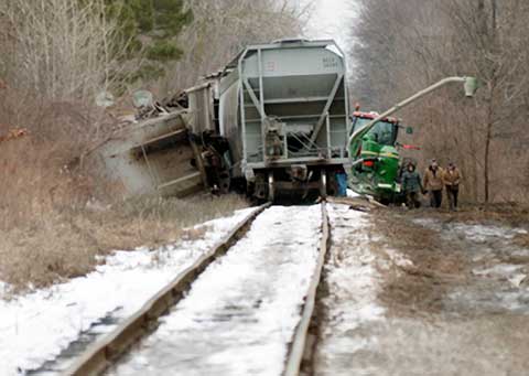A train derailed in Saginaw Township, MI spilling a load of grain alongside the tracks on February 9, 2013. Photo credit: Jeff Schrier / Mlive.com.