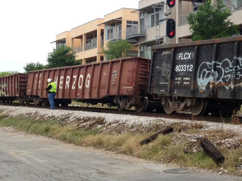 A freight train derailed in Austin, TX on April 3, 2013 causing delays for Capital Metro Rail passengers and vehicle traffic. It will take days for repair crews to repair the damage to the tracks. Photo credit: Jessica Vess / KVUE