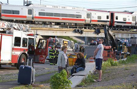 Two Amtrak trains collided in Bridgeport, CT near the border with Faifield, CT on May 13, 2013 injuring dozens. Photo credit:  Michelle McLoughlin / Reuters