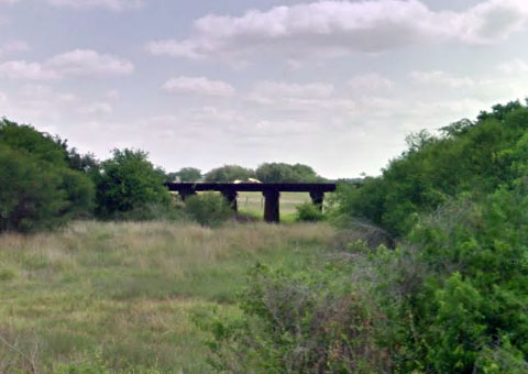 View from County Road 357 of a rail bridge where one Union Pacific Railroad worker was killed and another injured about 4.8 miles northwest of Mathis, TX on September 4, 2013.