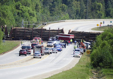 Hazmat and emergency crews responding at the scene of a Norfolk Southern train derailment after a collision with a semi truck in McBean, GA on September 17, 2013. Photo credit: Michael Holahan / Augusta Chronicle 